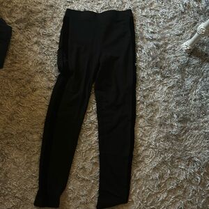 Black Leggings with almost fuzzy stripes on the sides of both legs.